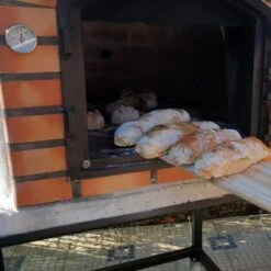 Lisboa Brick Pizza Oven PREMIUM -Primo Store BakingBreadintheLisboaPremiumOven