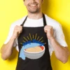 "Keep Rising" Baking Apron -Primo Store KeepRisingYellowBackground 1